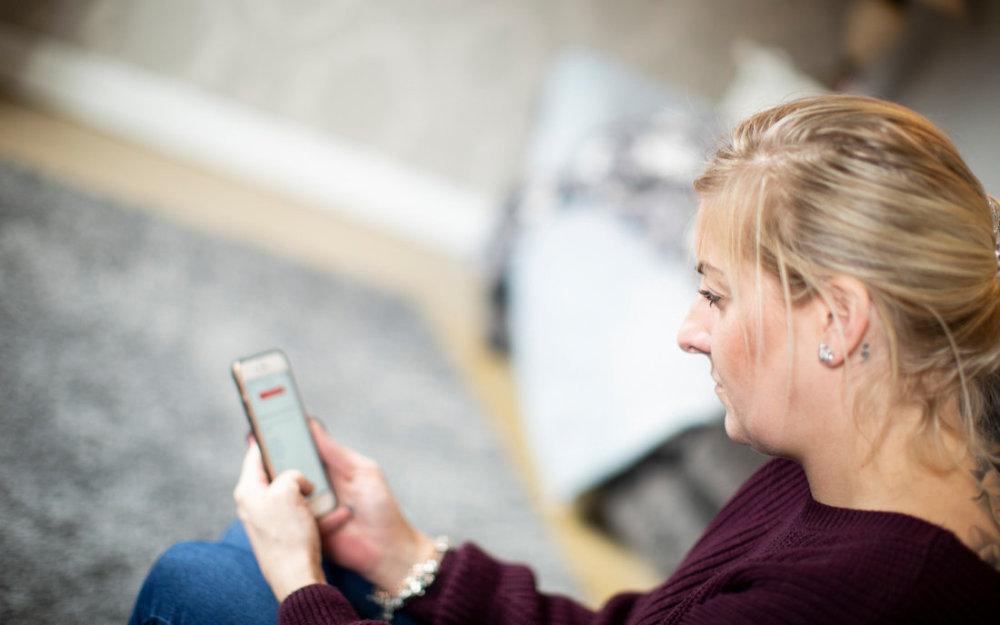 Woman looking at her mobile phone.