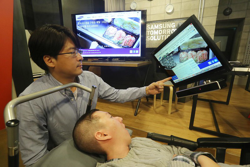 user-with-disability-and-carer.jpg