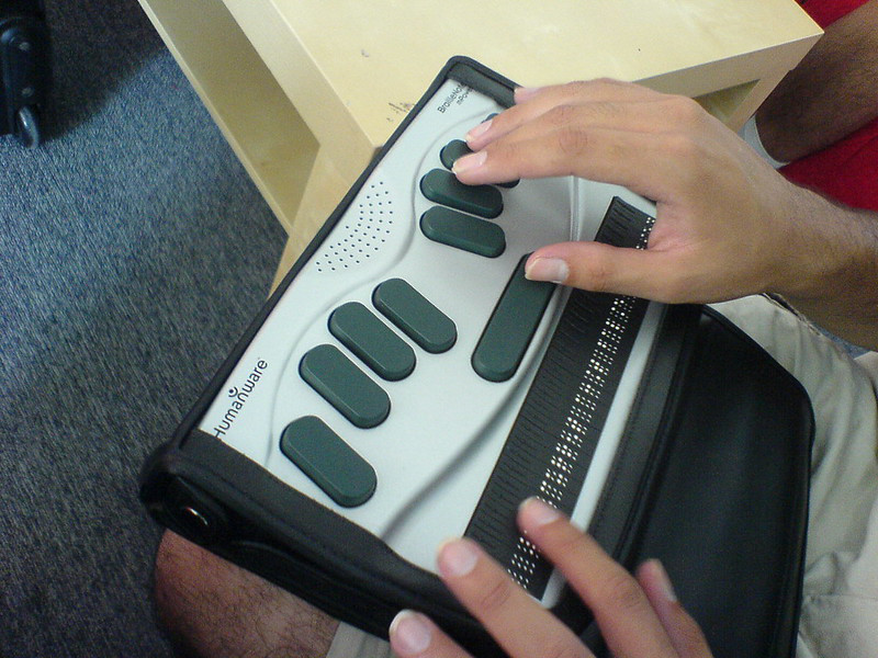 A web user using an accessible keyboard.